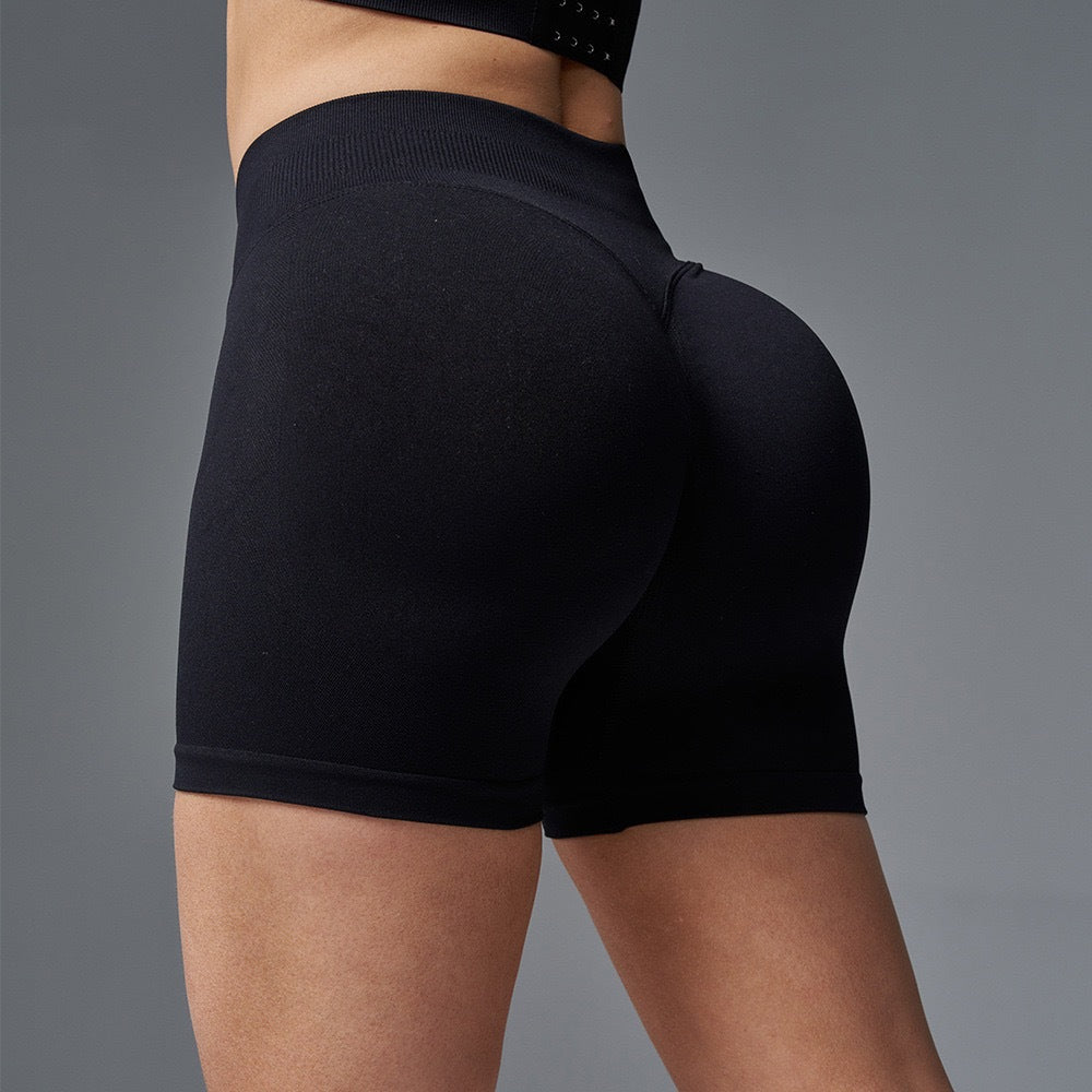 Mid-rise hip seamless knitted hip lifting yoga pants three-point peach hip fitness pants quick-drying sports shorts women's summer