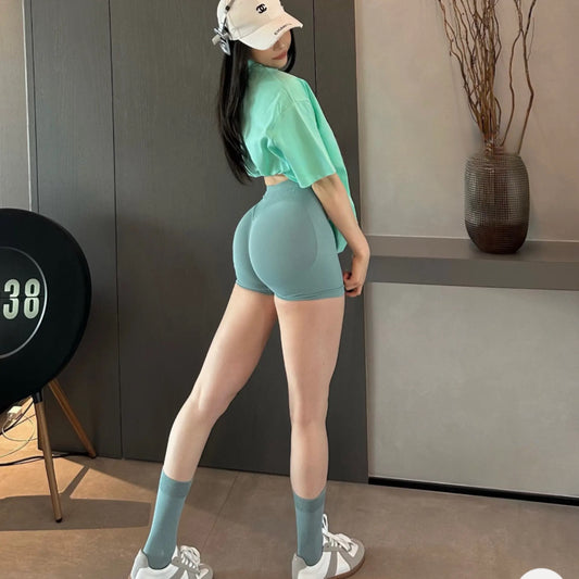 Mid-rise hip seamless knitted hip lifting yoga pants three-point peach hip fitness pants quick-drying sports shorts women's summer